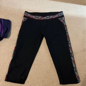 Fabletics XL capri leggings, grey, green, and red pattern on sides and top